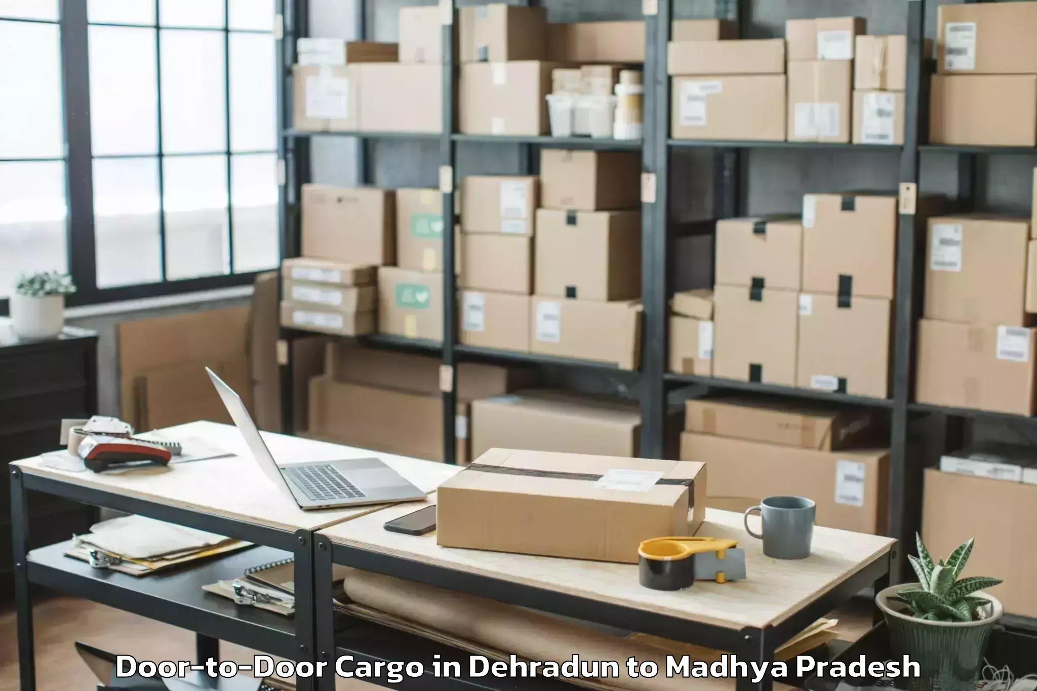 Affordable Dehradun to Badod Door To Door Cargo